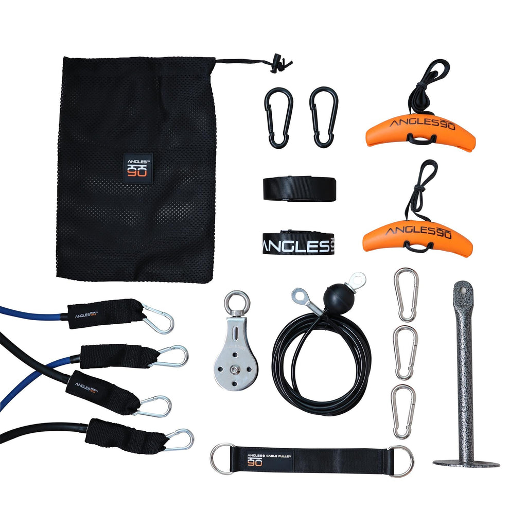 Assorted collection of climbing gear and accessories neatly arranged on a white background, including carabiners, a pulley, slings, a hammer, A90 Full Set Trainer, and a storage pouch.
