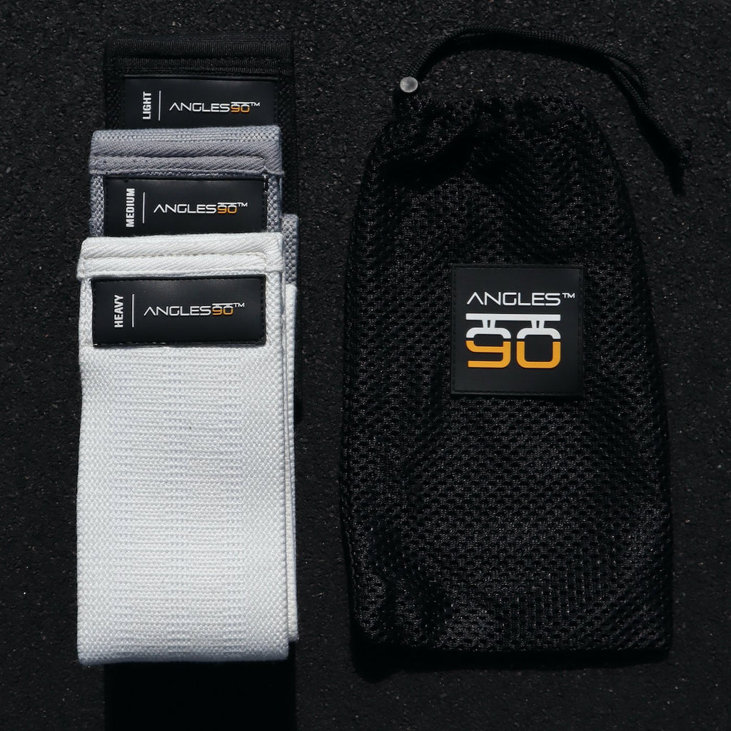 A collection of A90 Hip Bands by angles90, displayed in white and black variants, designed for workout exercises including hip movement, alongside a branded black mesh carrying pouch.